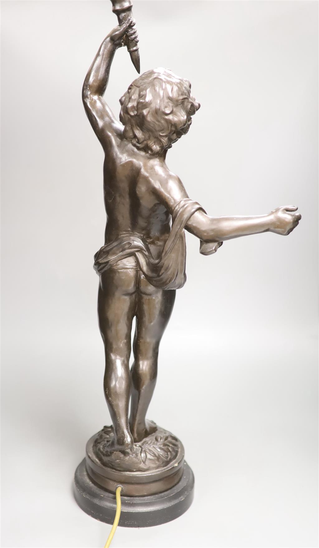 A spelter cherub lamp with flame shade, height 89cm